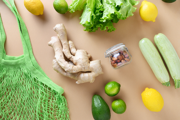 Tablet top with green and yellow fruits and vegetables.