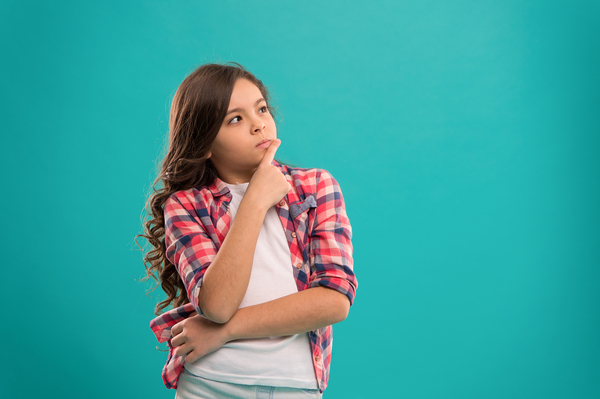 Young teen looking perplexed.