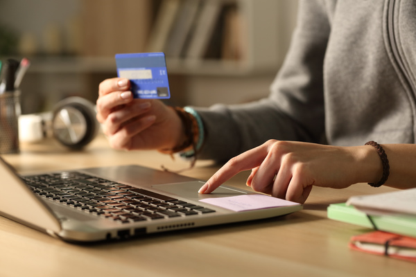 Shopping online with a credit card.