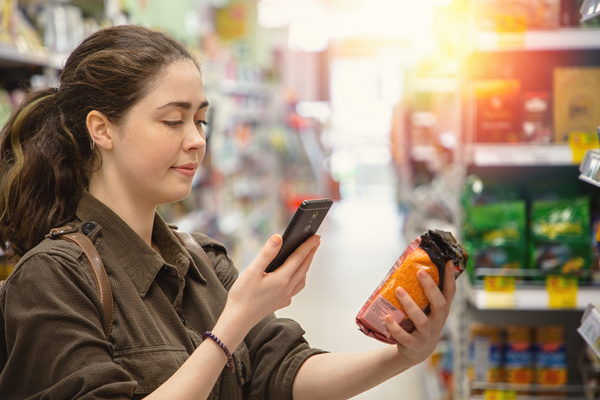 Woman reading a label.