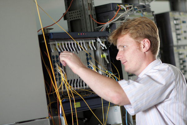 Technician working with computer hardware.