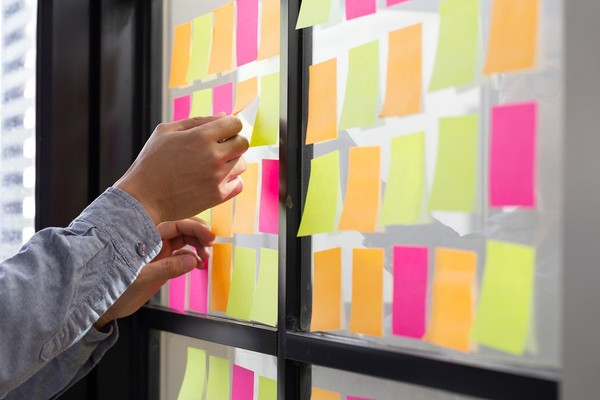 Post-it notes placed on a window.
