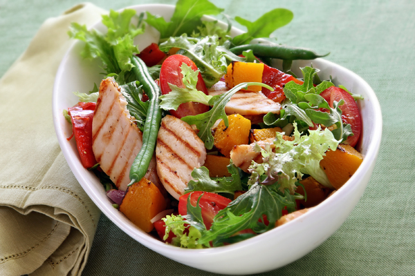 Healthy salad with grilled chicken.