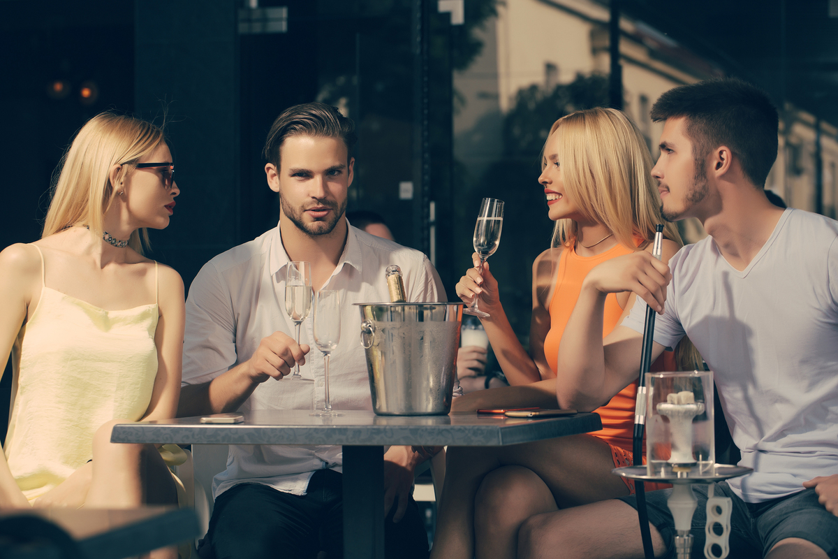 Group of young adults drinking champaign.