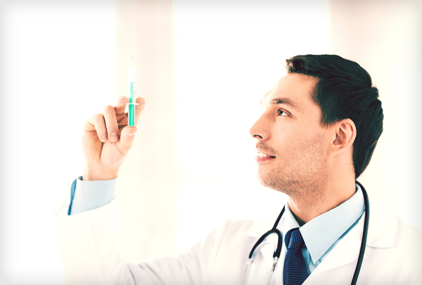 Physician with a syringe.