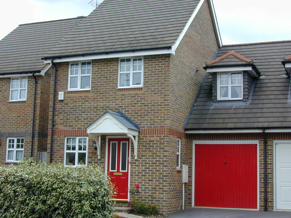 HHouse with bright red garage door