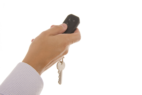 HHand holding garage door remote
