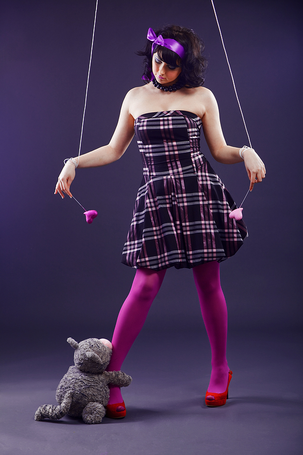 Teen being silly with stuffed bear.