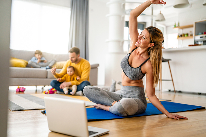 Woman stretching in her living room.