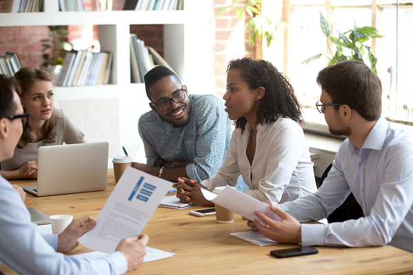 Group of colleagues meeting around a table.