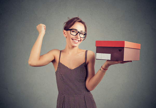 Woman holding a package.