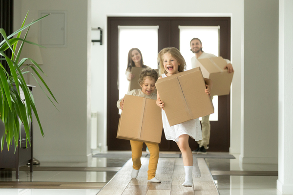 Happy family with brown packages.