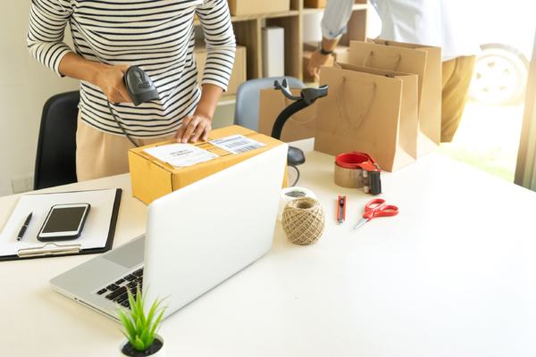 Woman scanning a package.