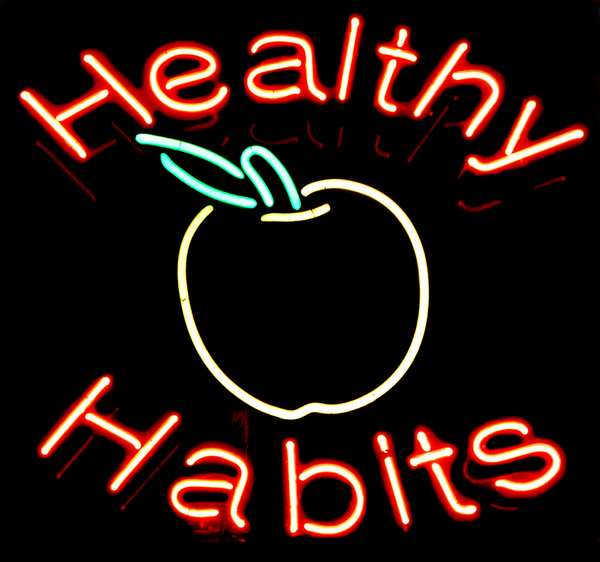 Fluorescent Healthy Habits sign.