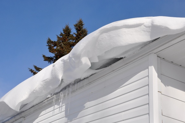 Snow hanging off a roof.