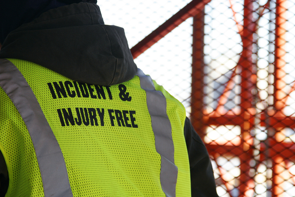 Construction worker with yellow reflective vest.