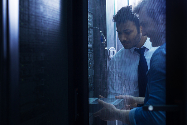 Person working in front of a server.