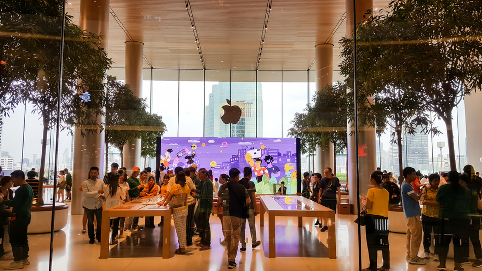 Apple store filled with customers.