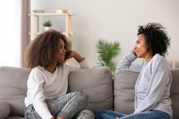Mom and teen daughter having a discussion.
