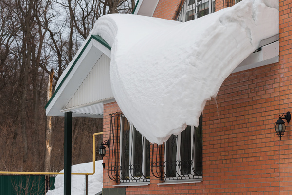 Snow pilled up on roof.