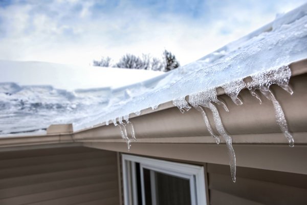 Ice in and hanging from gutters.