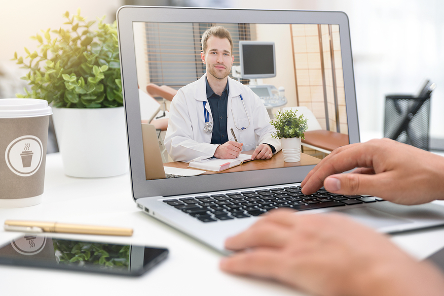 Telehealth visit using a laptop.