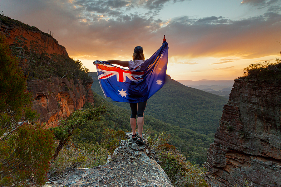 Woman holding up a flag.