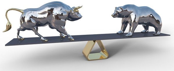 A bull and bear on a seesaw.