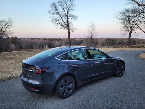 Tesla in a driveway.