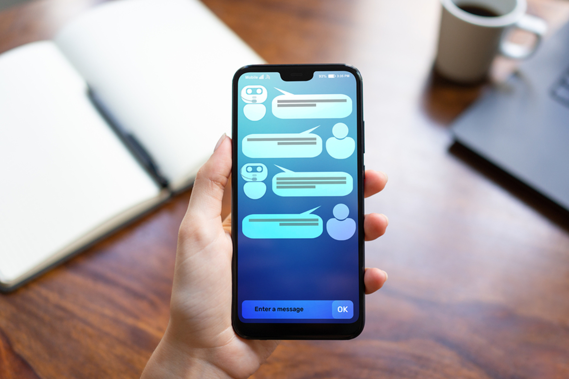 Phone with a chat displayed on screen. Phone with a chat displayed on screen.